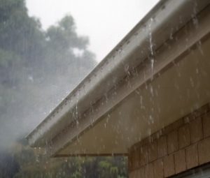 gutter with rain Over The Top Roofing